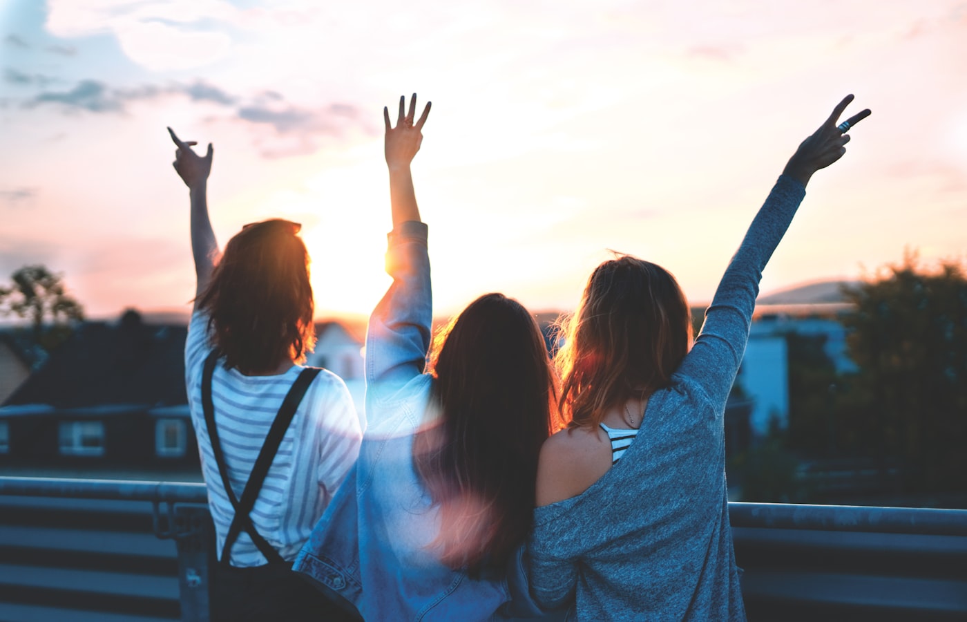 Three women together at sunset — Femcare community